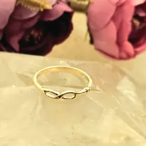 anel ouro infinito vazado com ponto de luz