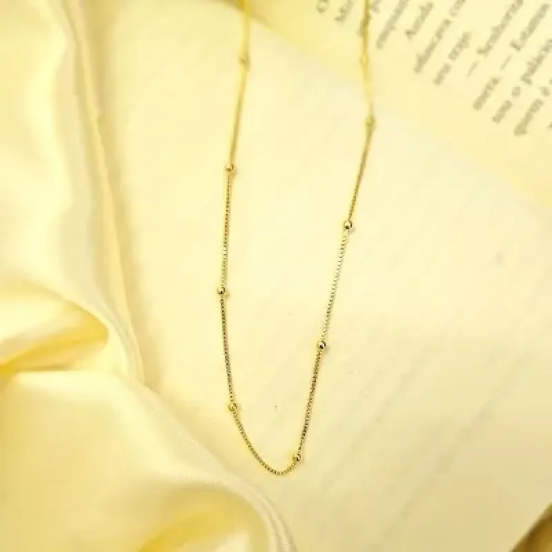 colar ouro longo bolinhas lisas espaçadas
