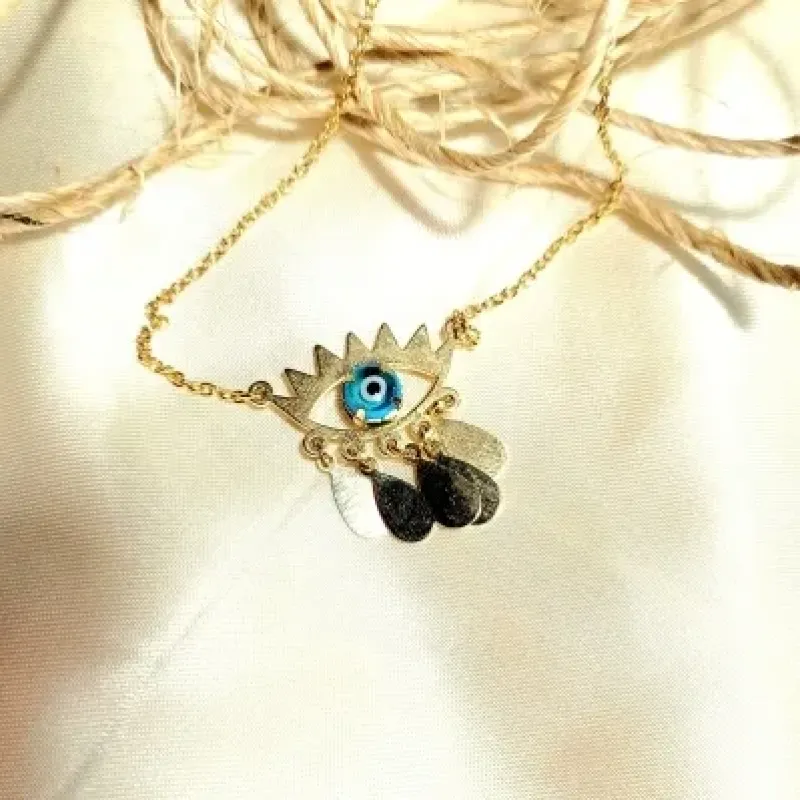 colar ouro olho grego azul com gotinhas lisas penduradas