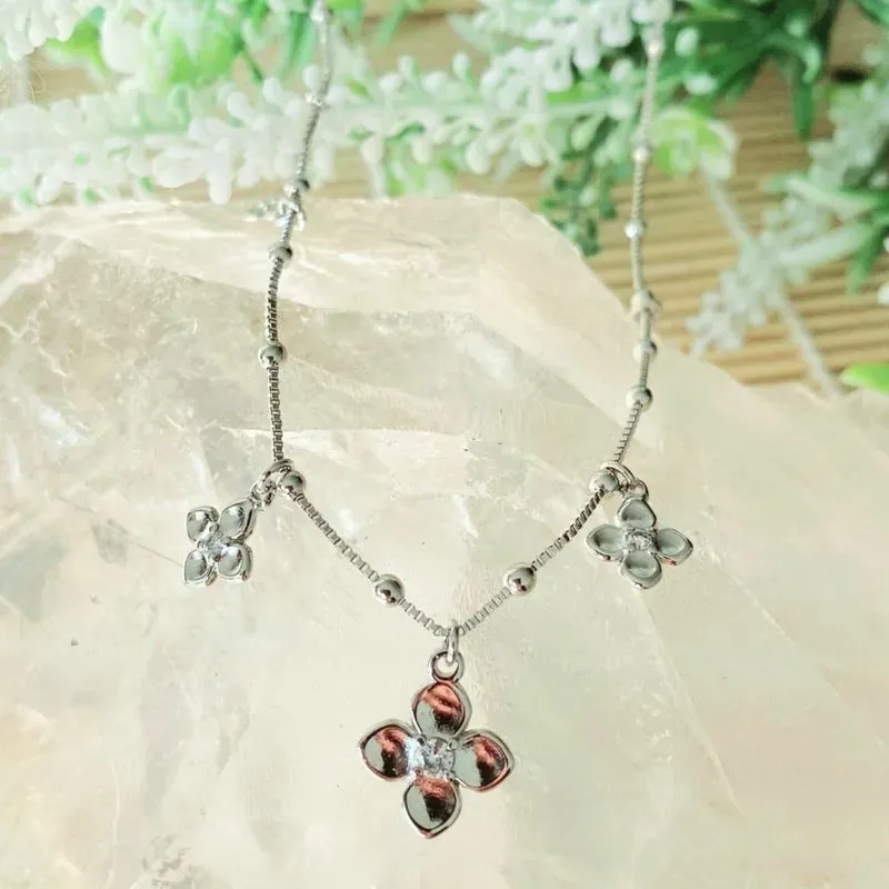 colar rodio choker flor ponto de luz cristal no meio
