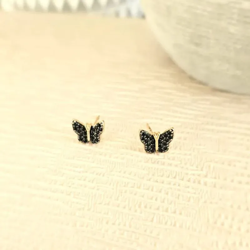 brinco ouro borboleta cravejada com zircônias pretas