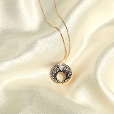 colar ouro circulo cravejado zircônias marrom com gota cristal invertida
