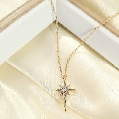 colar ouro corrente estrela 8 pontas puxada para baixo cravejada