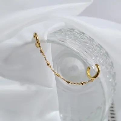piercing ouro duplo argolinha cima e baixo com correntinha