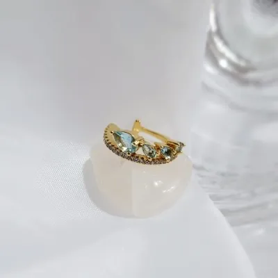piercing ouro fileira zirconias 4 gotinhas azul