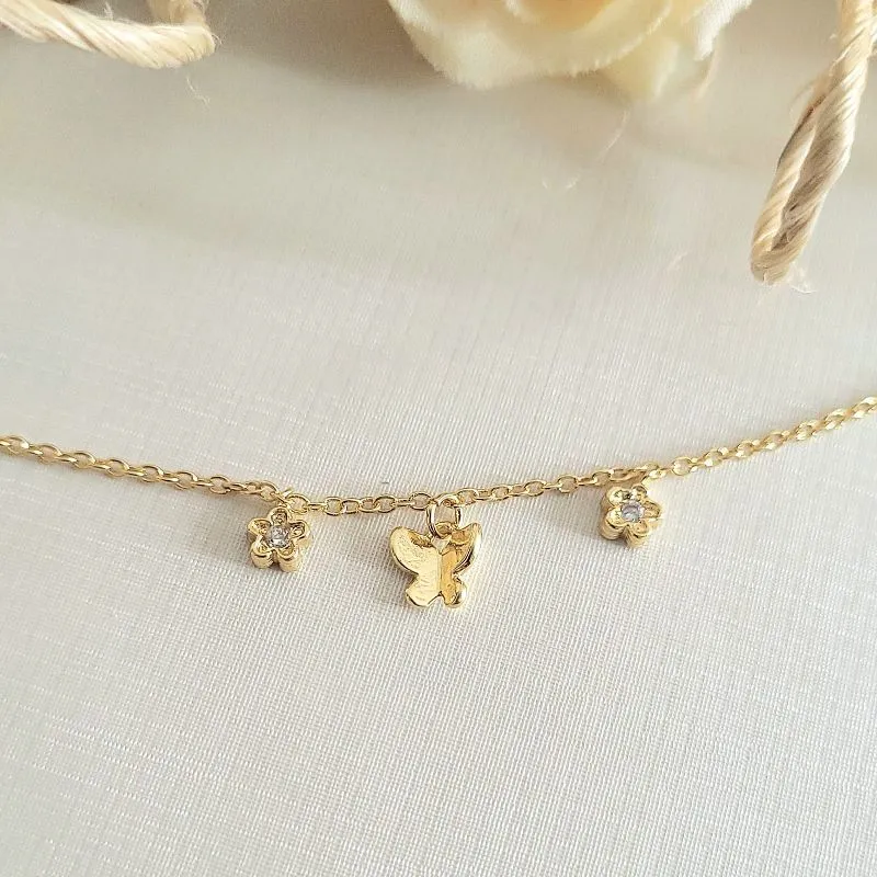 pulseira ouro borboleta lisa e flor com pedras cristais