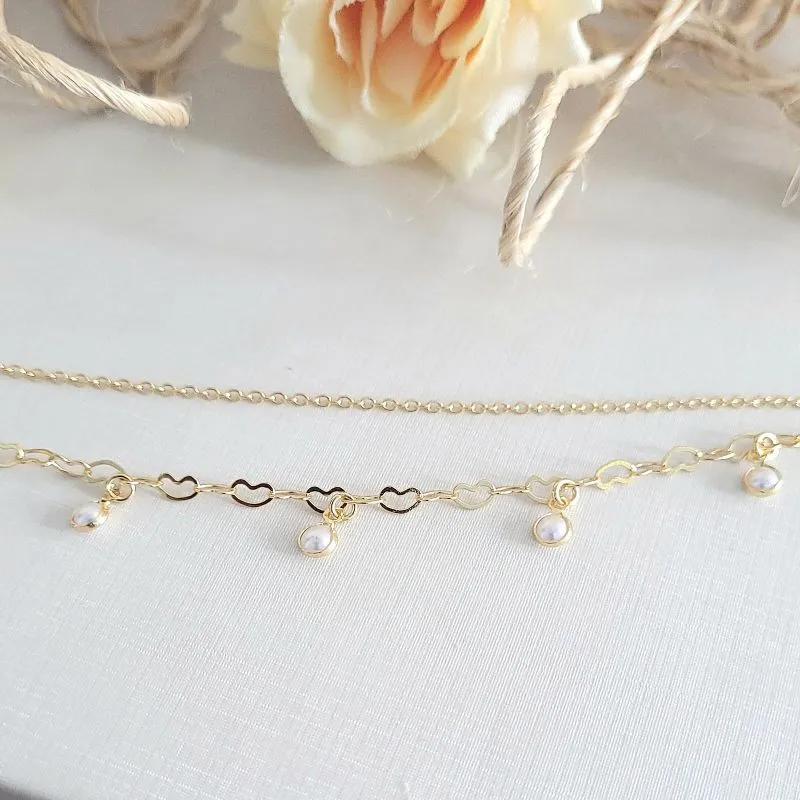 pulseira ouro dupla perolas com pulseira de coração e elo português
