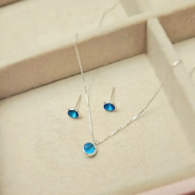 conjunto prata circulo azul claro