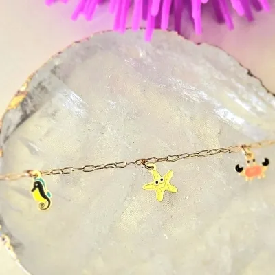 pulseira infantil ouro cavalo marinho + estrela do mar + siri