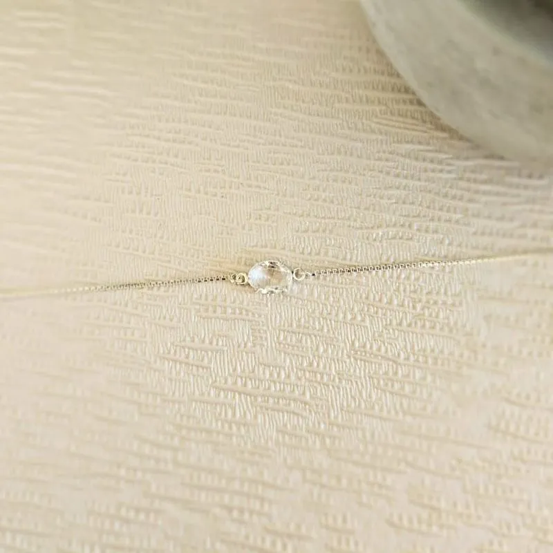 pulseira prata ponto de luz oval cristal