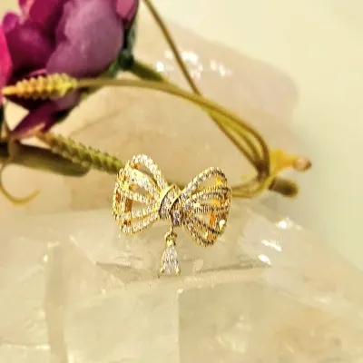 anel ouro laço com zirconias