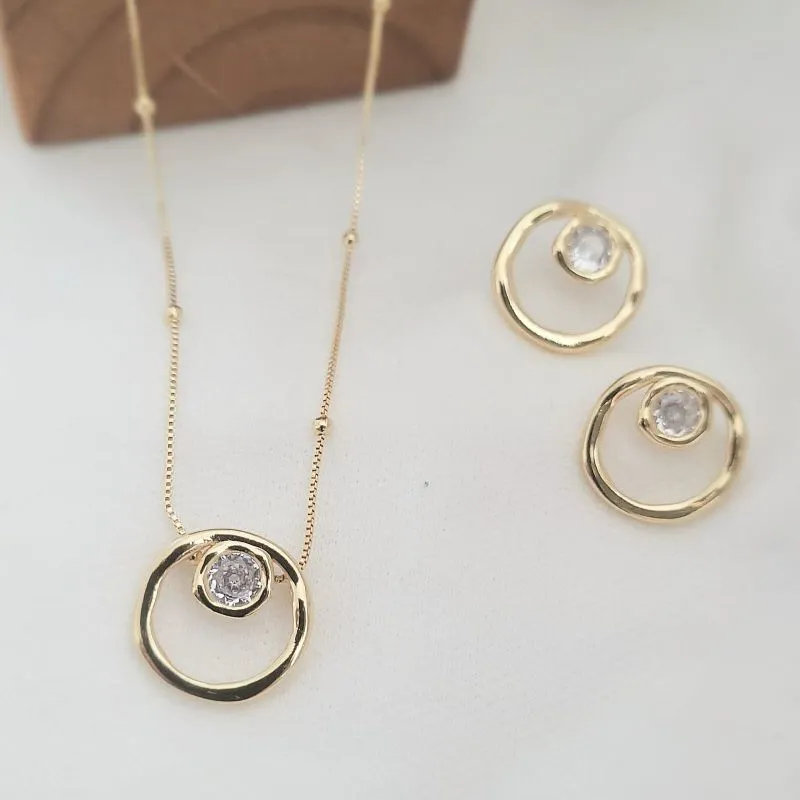 conjunto ouro circulo vazado com ponto de luz no meio