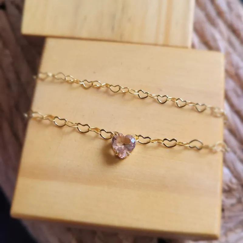 pulseira ouro dupla coração nude
