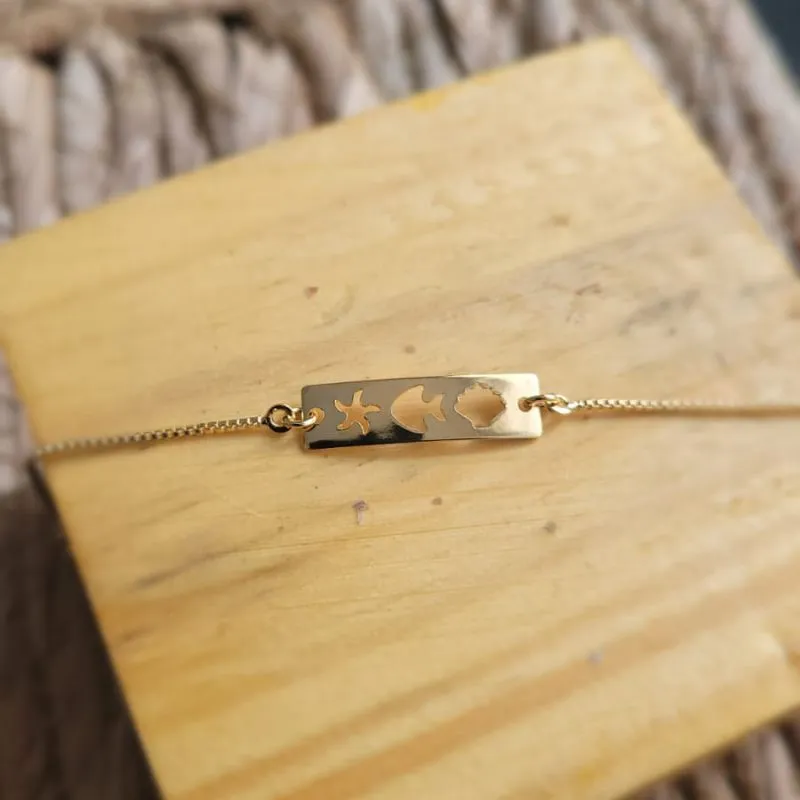 pulseira ouro infantil placa estrela peixe e concha