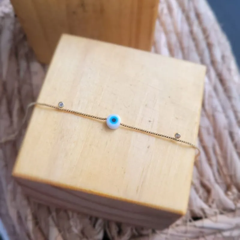 pulseira ouro olho grego com pontos de luz