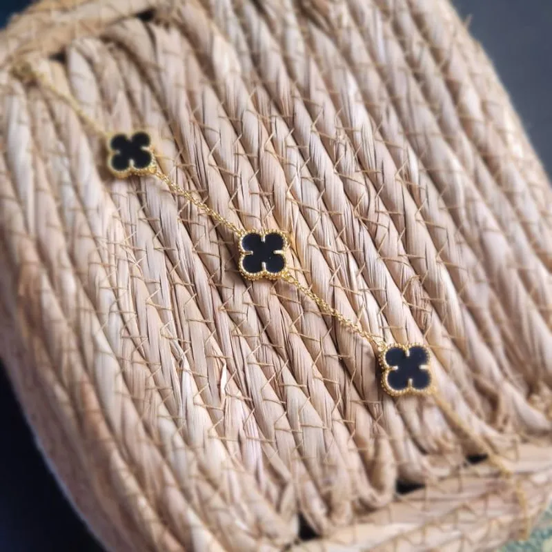 pulseira ouro van cleef preto