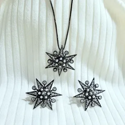 conjunto ródio negro com estrela cravejada zircônias